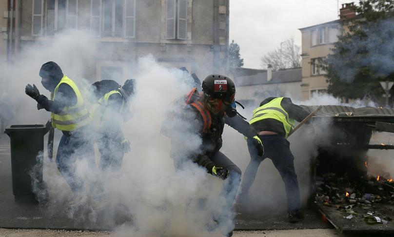 36165 80000 yellow vests take to the streets in violent protests video of police beating women 532742148 1547374433844