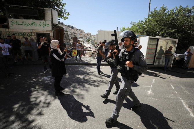 Palestinians clash with Israels demolition forces.